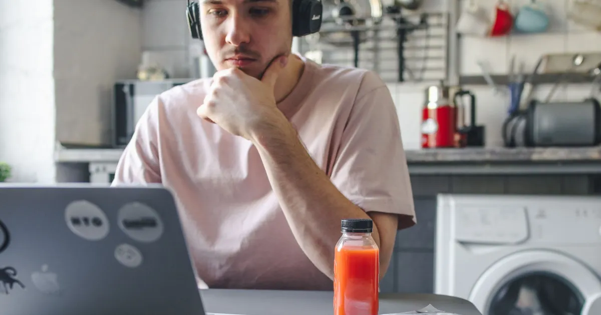 Person at a kitchen table calmly reviewing a bank statement before applying for bad credit loans Saskatoon lenders decide on income